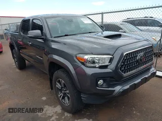 2018 Toyota Tacoma SR5 with VIN 3TMAZ5CN0JM061233, listed as a IAAI auction lot 41944668 with 94,314 mi miles and . Bid and sale history available at DreamBid. Image 1.
