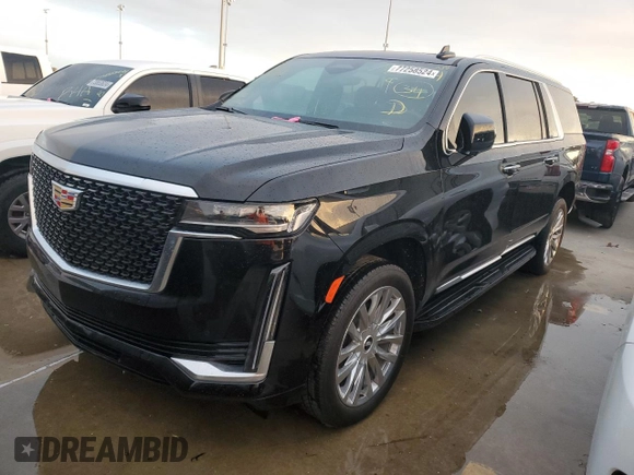 2023 Cadillac Escalade z VIN 1GYS3KKL3PR360009, wystawiony jako Copart lot #77258524 z przebiegiem 12 874 mil mil oraz Szkoda całkowita • Salvage title. Historia ofert i sprzedaży dostępna na DreamBid. Obrazek 1.