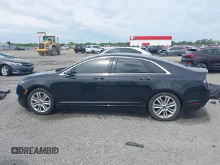 2015 Lincoln MKZ z VIN 3LN6L2JK7FR622029, wystawiony jako IAAI lot #42180170 z przebiegiem 107 732 mil mil oraz . Historia ofert i sprzedaży dostępna na DreamBid. Obrazek 15.