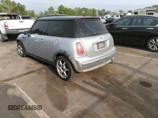 2002 MINI Hardtop with VIN WMWRC33432TE10226, listed as a IAAI auction lot 41973956 with 156,445 mi miles and . Bid and sale history available at DreamBid. Image 3.