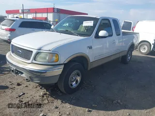 1999 Ford F-150 XL with VIN 1FTRX18L3XKB33860, listed as a IAAI auction lot 41664761 with 305,767 mi miles. Bid and sale history available at carsss.com. Image 2.