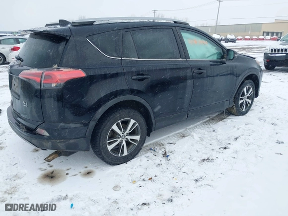 2018 Toyota RAV4 XLE with VIN 2T3RFREV8JW851250, listed as a IAAI auction lot 41164994 with 63,005 mi miles. Bid and sale history available at carsss.com. Image 4.