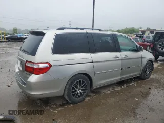 2005 Honda Odyssey EX with VIN 5FNRL38415B410659, listed as a Copart auction lot 58535455 with 198,250 mi miles and Salvage title. Bid and sale history available at DreamBid. Image 3.