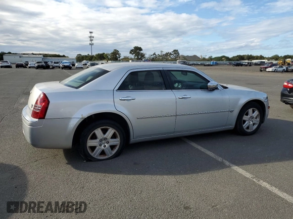 2006 Chrysler 300 C with VIN 2C3KK63H46H296625, listed as a Copart auction lot 70220974 with 104,811 mi miles and Salvage Title. Bid and sale history available at carsss.com. Image 3.