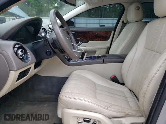 2013 Jaguar XJ with VIN SAJWA1C77D8V41738, listed as a Copart auction lot 53796225 with 104,063 mi miles and Salvage Title. Bid and sale history available at DreamBid. Image 7.