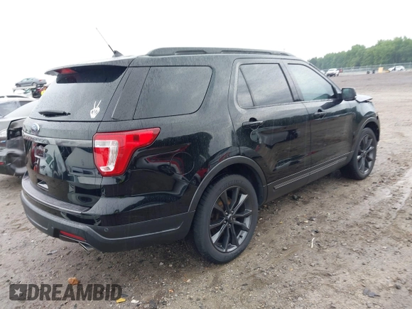2018 Ford Explorer XLT z VIN 1FM5K7D87JGA56109, wystawiony jako IAAI lot #42423403 z przebiegiem 80 082 mil mil oraz . Historia ofert i sprzedaży dostępna na DreamBid. Obrazek 4.