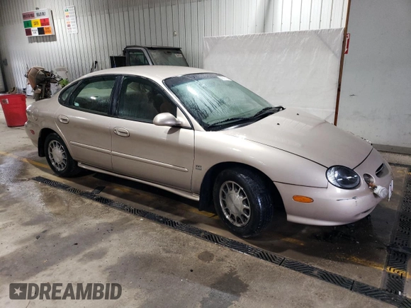 1999 Ford Taurus SE with VIN 1FAFP53S6XA242981, listed as a Copart auction lot 43211425 with 111,966 mi miles and Salvage title. Bid and sale history available at DreamBid. Image 4.