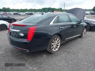 2013 Cadillac XTS Luxury z VIN 2G61P5S34D9183065, wystawiony jako IAAI lot #42665741 z przebiegiem 209 585 mil mil oraz . Historia ofert i sprzedaży dostępna na DreamBid. Obrazek 4.