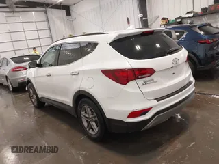2017 Hyundai Santa Fe 2.4L z VIN 5XYZU3LBXHG444308, wystawiony jako IAAI lot #41685902 z przebiegiem 70 838 mil mil oraz . Historia ofert i sprzedaży dostępna na DreamBid. Obrazek 3.