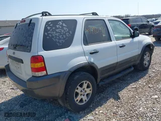 2004 Ford Escape XLT with VIN 1FMYU93164KA96674, listed as a IAAI auction lot 41780474 with 182,525 mi miles. Bid and sale history available at carsss.com. Image 4.