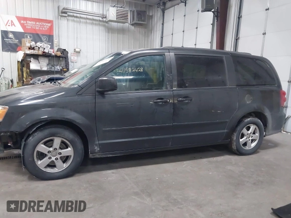 2012 Dodge Grand Caravan SXT with VIN 2C4RDGCG7CR358266, listed as a IAAI auction lot 41582428 with 169,137 mi miles and . Bid and sale history available at DreamBid. Image 14.