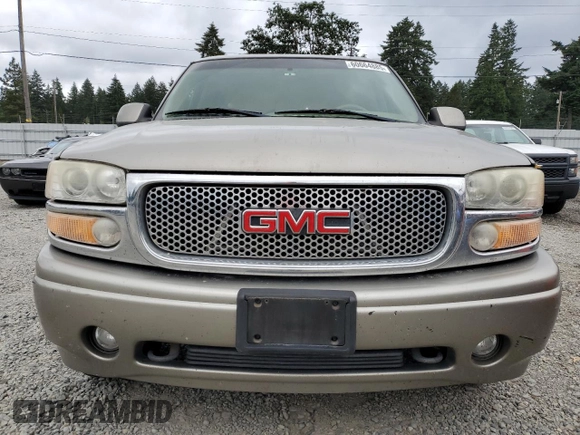 2002 GMC Yukon Denali z VIN 1GKEK63U82J224913, wystawiony jako Copart lot #60664885 z przebiegiem 208 794 mil mil oraz Szkoda całkowita • Salvage title. Historia ofert i sprzedaży dostępna na DreamBid. Obrazek 5.