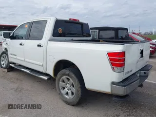 2011 Nissan Titan SL with VIN 1N6AA0EC7BN313599, listed as a IAAI auction lot 41888934 with 182,894 mi miles. Bid and sale history available at carsss.com. Image 3.