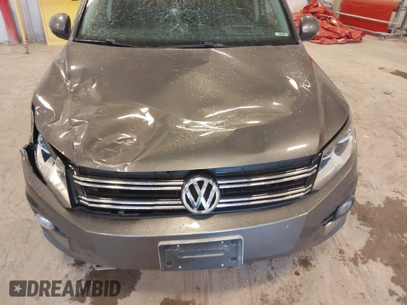 2012 Volkswagen Tiguan SE with VIN WVGBV7AX6CW093750, listed as a IAAI auction lot 42329775 with 117,509 mi miles and . Bid and sale history available at DreamBid. Image 6.