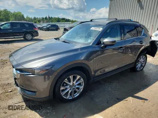 2019 Mazda CX-5 Grand Touring with VIN JM3KFBDM2K0677061, listed as a Copart auction lot 62940235 with 66,507 mi miles and Salvage title. Bid and sale history available at DreamBid. Image 1.