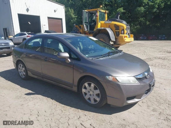 2010 Honda Civic Sdn LX with VIN 2HGFA1F57AH587327, listed as a IAAI auction lot 40209466 with 121,228 mi miles. Bid and sale history available at carsss.com. Image 1.