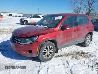 2013 Volkswagen Tiguan S with VIN WVGAV3AX2DW063067, listed as a IAAI auction lot 41638749 with 150,115 mi miles and . Bid and sale history available at DreamBid. Image 2.