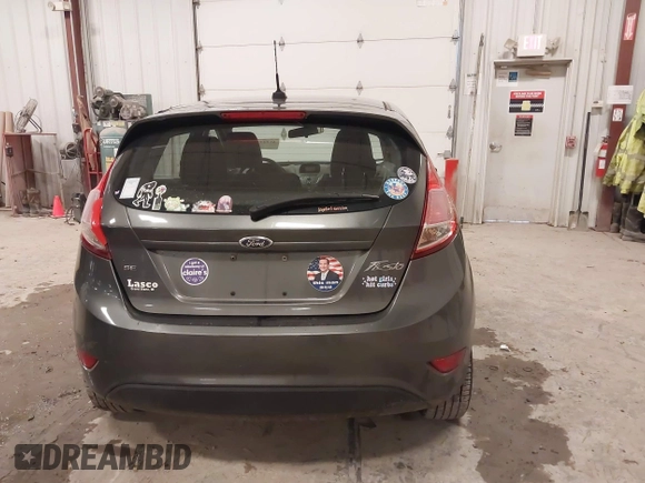 2015 Ford Fiesta SE z VIN 3FADP4EJ8FM138306, wystawiony jako IAAI lot #41227124 z przebiegiem 106 741 mil mil oraz . Historia ofert i sprzedaży dostępna na DreamBid. Obrazek 16.