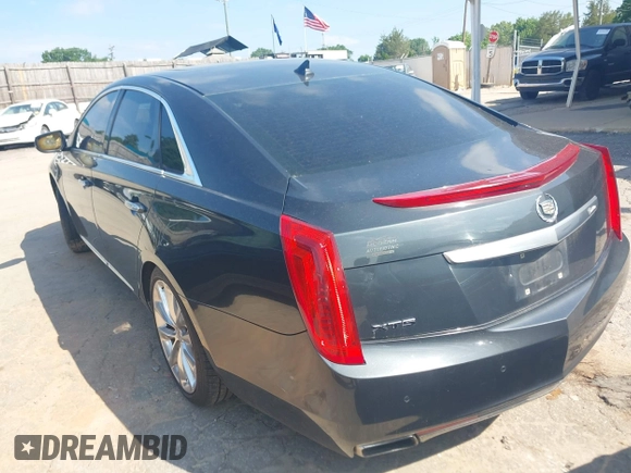 2013 Cadillac XTS Luxury z VIN 2G61P5S37D9110658, wystawiony jako IAAI lot #42196442 z przebiegiem 182 228 mil mil oraz . Historia ofert i sprzedaży dostępna na DreamBid. Obrazek 3.