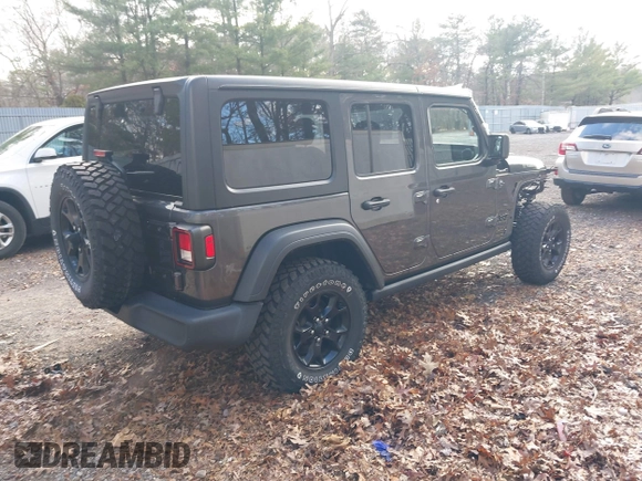 2021 Jeep Wrangler Unlimited Sport S with VIN 1C4HJXDN4MW518307, listed as a IAAI auction lot 41222996 with 39,499 mi miles and . Bid and sale history available at DreamBid. Image 4.