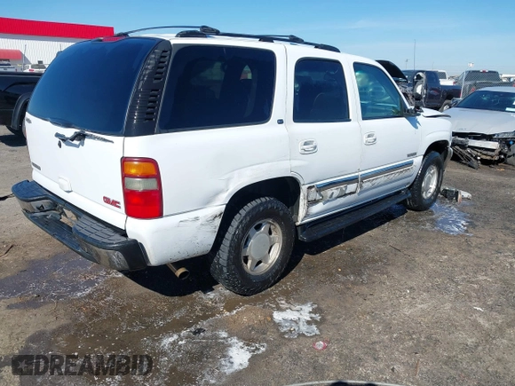 2003 GMC Yukon SLT with VIN 1GKEC13Z13J197955, listed as a IAAI auction lot 41586841 with 208,752 mi miles. Bid and sale history available at carsss.com. Image 4.