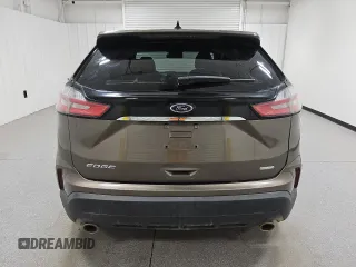 2019 Ford Edge SE с VIN 2FMPK3G93KBC51378, выставлен на аукционе Copart как лот 61231395 с пробегом 144 269 миль миль и Чистый • Clean title. История ставок и продаж доступна на DreamBid. Изображение 6.