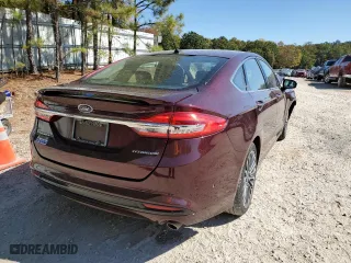 2017 Ford Fusion Energi Titanium with VIN 3FA6P0SU2HR253960, listed as a Copart auction lot 64313662 with 148,424 mi miles. Bid and sale history available at carsss.com. Image 4.