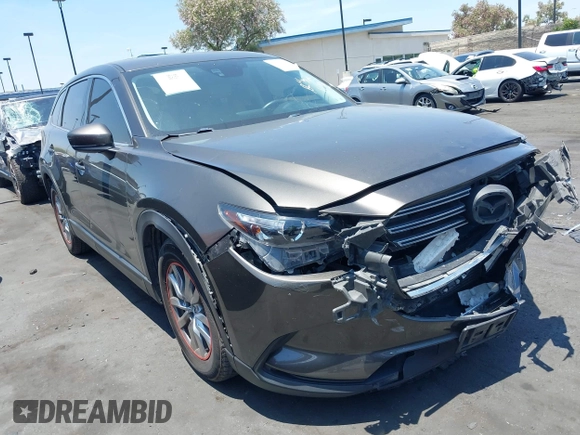 2017 Mazda CX-9 Touring with VIN JM3TCBCY1H0131233, listed as a IAAI auction lot 42490137 with 84,216 mi miles and . Bid and sale history available at DreamBid. Image 1.