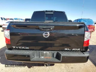 2017 Nissan Titan SL z VIN 1N6AA1E54HN554049, wystawiony jako Copart lot #81404094 z przebiegiem 97 811 mil mil oraz Czysty tytuł • Clean title. Historia ofert i sprzedaży dostępna na DreamBid. Obrazek 6.