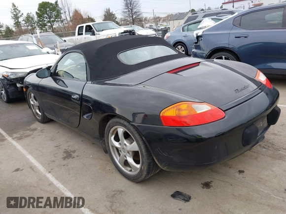 2002 Porsche Boxster z VIN WP0CA298X2U623474, wystawiony jako IAAI lot #41754154 z przebiegiem 98 896 mil mil oraz . Historia ofert i sprzedaży dostępna na DreamBid. Obrazek 3.