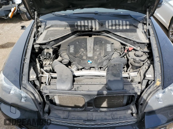 2012 BMW X5 50i with VIN 5UXZV8C59CL424356, listed as a Copart auction lot 54763725 with 107,712 mi miles and Salvage title. Bid and sale history available at DreamBid. Image 12.