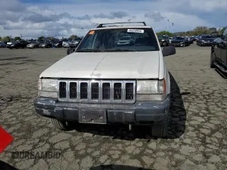 1997 Jeep Grand Cherokee Laredo with VIN 1J4GZ58S8VC647415, listed as a Copart auction lot 49258934 with 0 mi miles and Salvage Title. Bid and sale history available at carsss.com. Image 5.