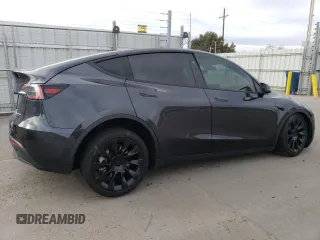 2024 Tesla Model Y Long Range with VIN 7SAYGAEE5RF038446, listed as a Copart auction lot 48868025 with 10,410 mi miles and Salvage Title. Bid and sale history available at DreamBid. Image 3.