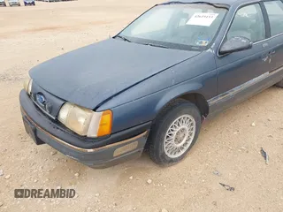 1987 Ford Taurus z VIN 1FABP53U0HA101874, wystawiony jako IAAI lot #42619153 z przebiegiem Nie podano mil oraz . Historia ofert i sprzedaży dostępna na DreamBid. Obrazek 6.