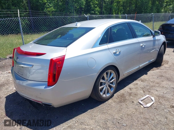 2014 Cadillac XTS Luxury z VIN 2G61M5S31E9199170, wystawiony jako IAAI lot #42150000 z przebiegiem 135 414 mil mil oraz . Historia ofert i sprzedaży dostępna na DreamBid. Obrazek 4.