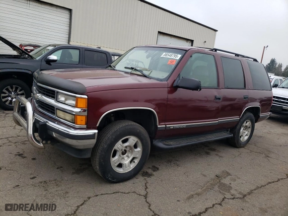 1999 Chevrolet Tahoe Z71 with VIN 1GNEK13R8XJ530020, listed as a Copart auction lot 46325435 with 409,412 mi miles and Salvage Title. Bid and sale history available at carsss.com. Image 1.