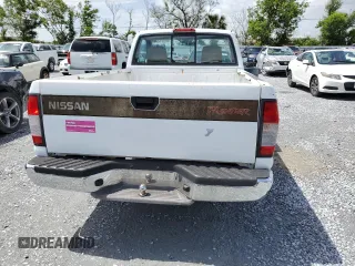 1998 Nissan Frontier XE z VIN 1N6DD21S5WC335549, wystawiony jako Copart lot #61021245 z przebiegiem 310 230 mil mil oraz Czysty tytuł • Clean title. Historia ofert i sprzedaży dostępna na DreamBid. Obrazek 6.