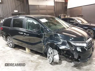2021 Honda Odyssey Touring with VIN 5FNRL6H83MB040138, listed as a IAAI auction lot 39150096 with 61,322 mi miles and . Bid and sale history available at DreamBid. Image 6.