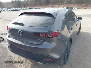 2021 Mazda 3 Premium with VIN JM1BPAML2M1310374, listed as a IAAI auction lot 41190608 with 97,648 mi miles. Bid and sale history available at carsss.com. Image 4.