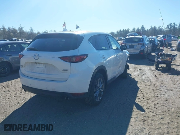 2019 Mazda CX-5 Grand Touring with VIN JM3KFBDM2K0672720, listed as a IAAI auction lot 41751196 with 51,632 mi miles and . Bid and sale history available at carsss.com. Image 4.