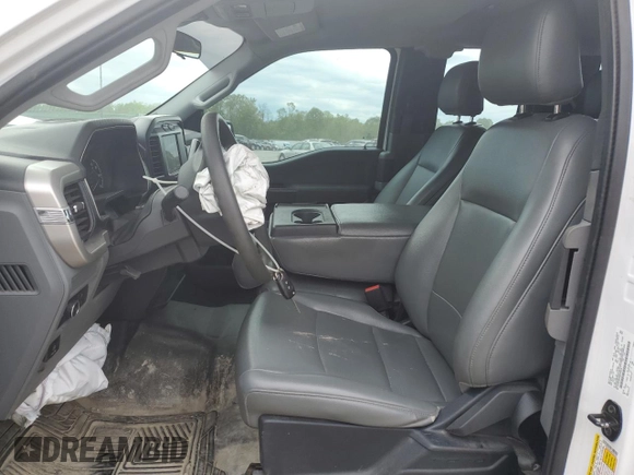 2021 Ford F-150 XL with VIN 1FTFX1E51MFC05216, listed as a Copart auction lot 56571785 with 94,584 mi miles and Salvage title. Bid and sale history available at DreamBid. Image 7.