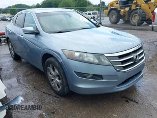 2010 Honda Crosstour EX-L z VIN 5J6TF2H58AL010406, wystawiony jako IAAI lot #42518578 z przebiegiem 228 764 mil mil oraz . Historia ofert i sprzedaży dostępna na DreamBid. Obrazek 1.