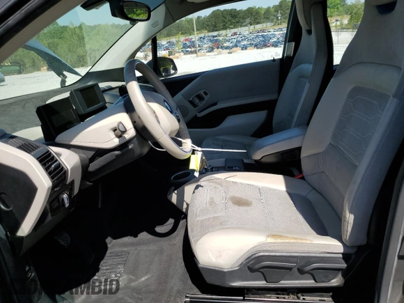 2016 BMW i3 z VIN WBY1Z2C58GV556419, wystawiony jako Copart lot #52809995 z przebiegiem 59 363 mil mil oraz Tytuł czysty. Historia ofert i sprzedaży dostępna na DreamBid. Obrazek 7.