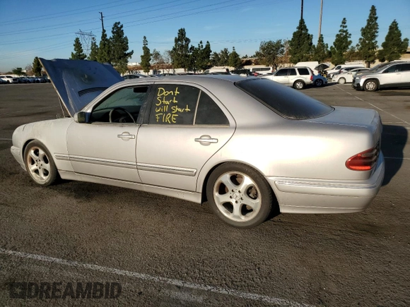 2002 Mercedes-Benz E-Class with VIN WDBJF65J32B496411, listed as a Copart auction lot 75690884 with 128,855 mi miles and Salvage Title. Bid and sale history available at carsss.com. Image 2.