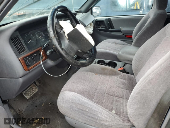 1998 Jeep Grand Cherokee Laredo with VIN 1J4GZ58SXWC293835, listed as a Copart auction lot 47557855 with 217,948 mi miles and Salvage Title. Bid and sale history available at carsss.com. Image 7.