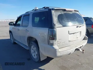 2009 GMC Yukon SLT w/4SA with VIN 1GKFK33039J117245, listed as a IAAI auction lot 41421302 with 199,864 mi miles. Bid and sale history available at carsss.com. Image 3.