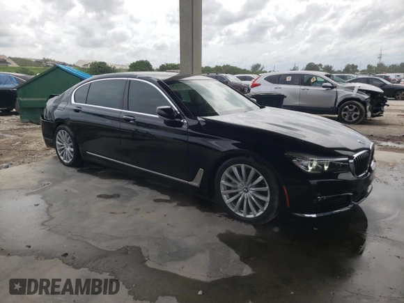 2017 BMW 7 Series 740i with VIN WBA7E2C31HG741176, listed as a Copart auction lot 65698233 with 27,332 mi miles. Bid and sale history available at carsss.com. Image 4.