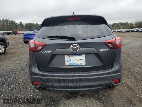 2016 Mazda CX-5 Grand Touring z VIN JM3KE2DY9G0687261, wystawiony jako Copart lot #52865415 z przebiegiem Nie podano mil oraz Szkoda całkowita • Salvage title. Historia ofert i sprzedaży dostępna na DreamBid. Obrazek 6.