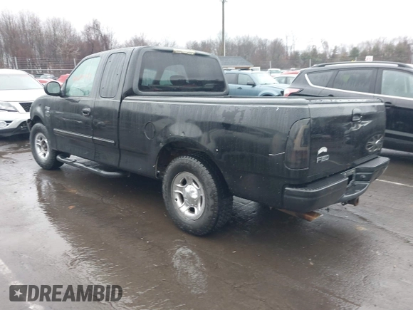 2002 Ford F-150 XL with VIN 1FTRX17W92NA80214, listed as a IAAI auction lot 41074951 with 164,048 mi miles. Bid and sale history available at carsss.com. Image 3.