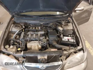 1999 Mazda 626 ES with VIN 1YVGF22C1X5852798, listed as a IAAI auction lot 41736489 with 136,536 mi miles. Bid and sale history available at carsss.com. Image 10.